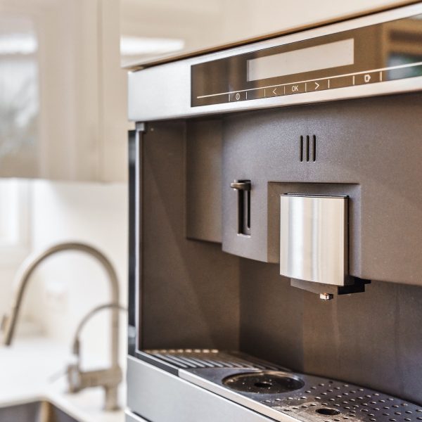 Drink tap on fridge in kitchen